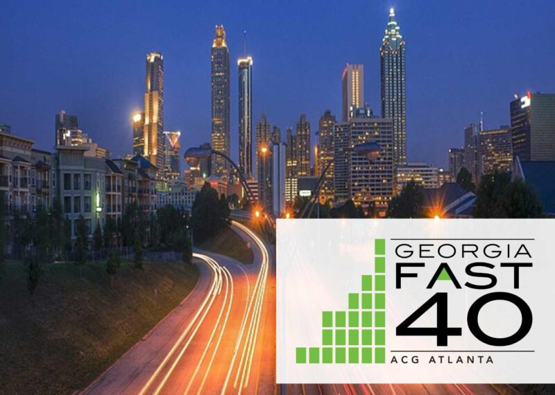 Night view of a city with ACG Fast 40 banner