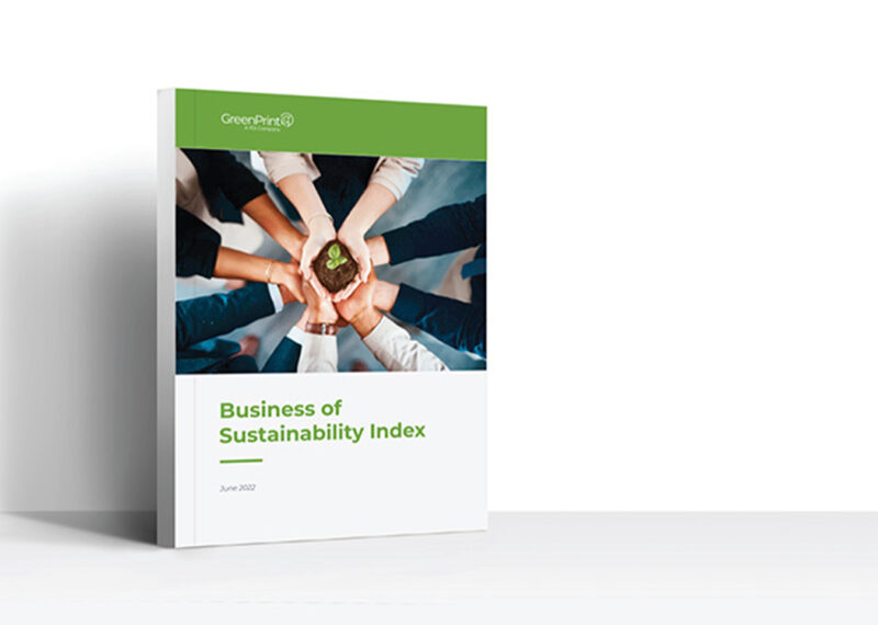 A book with a cover page depicting multiple hands holding a sapling with the title business of sustainability index