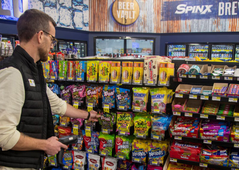 Man scanning candies at c-store