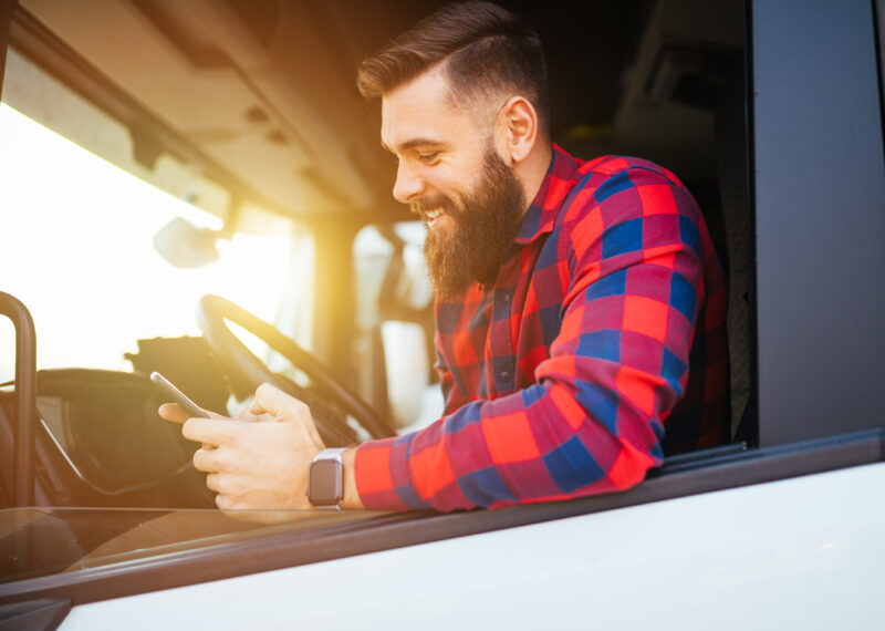 Truck driver using phone to view electronic POD