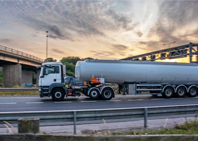 Fuel Tanker Truck moving on asphalt road