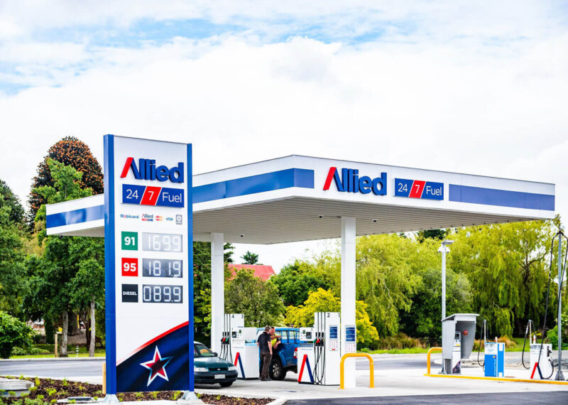 gas station pumps and sign with Allied logo