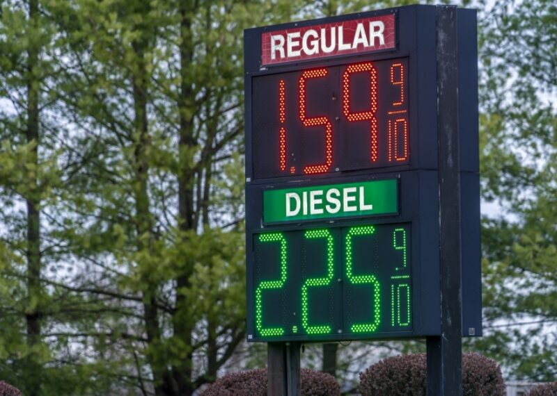 Prices listed on a digital sign at a gas station