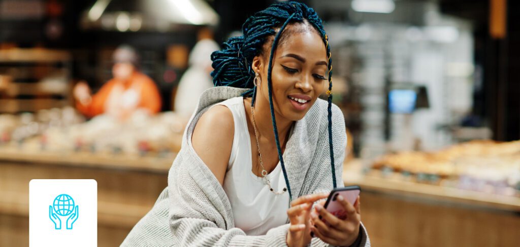 Woman shopping for consumer packaged goods while on cell phone.