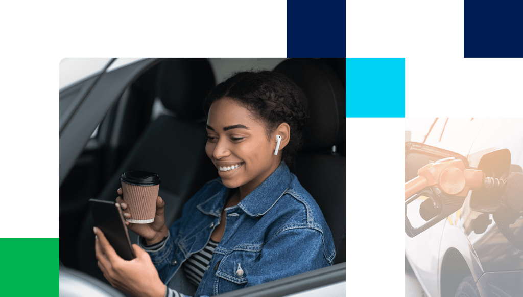 Portrait of young and cheerful woman with coffee cup sits in car in city on break