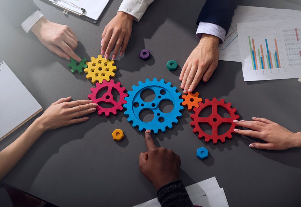 Business team connect pieces of gears, partnership and integration concept