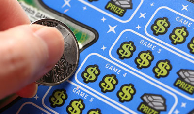 Scratching a lottery ticket with a coin