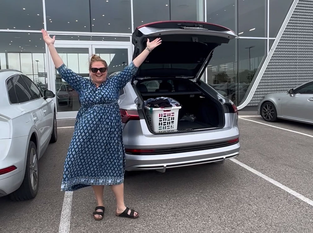 Bethany Allee celebrates new EV by moving laundry from old ICE car to electric vehicle