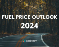 View of two lane road through forest, GasBuddy Fuel Price Outlook 2024