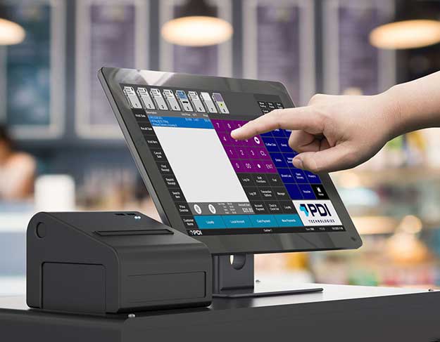 Hand using a PDI Technologies point-of-sale (POS) touchscreen system in a retail store with a receipt printer in the foreground.