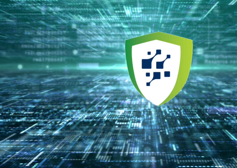 A digital shield icon representing the US Cyber Trust Mark over a futuristic network background, symbolizing secure IoT devices and reduced cyber risk.