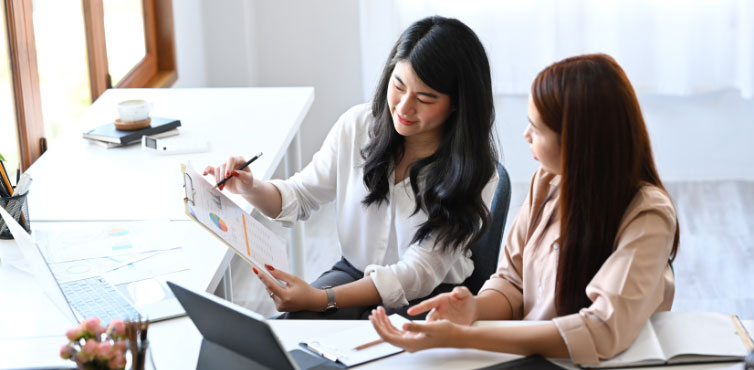 Business professionals discussing fleet fueling network partnership