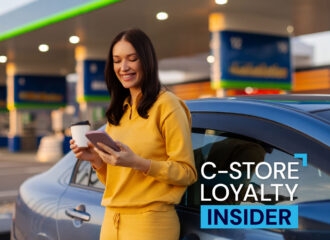 C-store customer using mobile loyalty app at fuel pump or inside convenience store