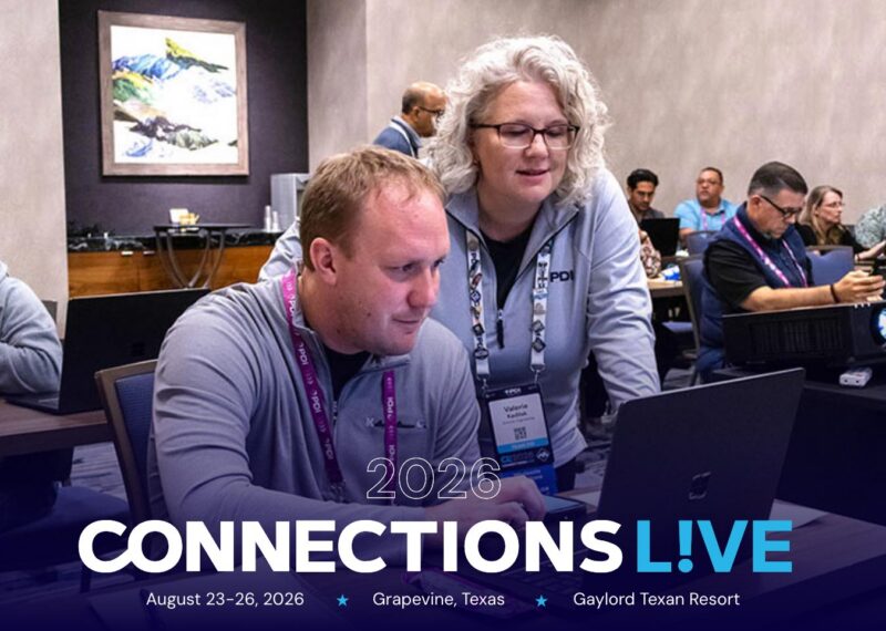 PDI instructor helping an attendee during a hands-on training session at Connections Live