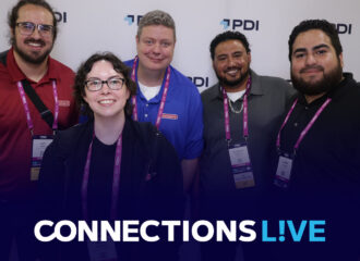 Five smiling Connections Live attendees wearing PDI lanyards and event badges, posing together in front of a PDI-branded backdrop.