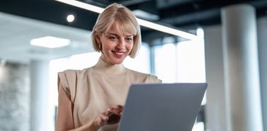 Woman working on a laptop, building a marketing campaign