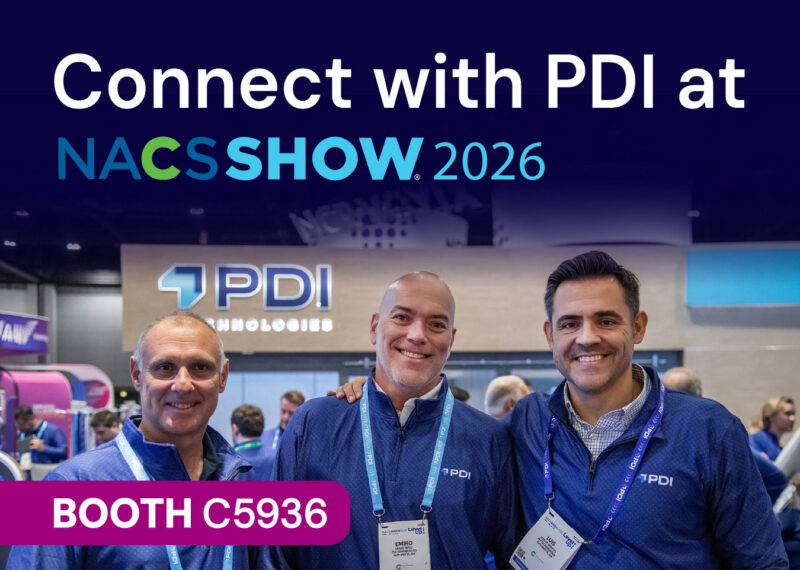 Three smiling PDI team members in front of the PDI Technologies booth. Text reads: Connect with PDI at NACS Show 2026, Booth C5936.